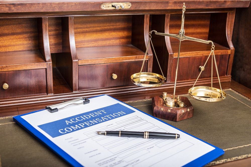 A legal document and a pen on a desk, representing Texas personal injury claim mistakes.