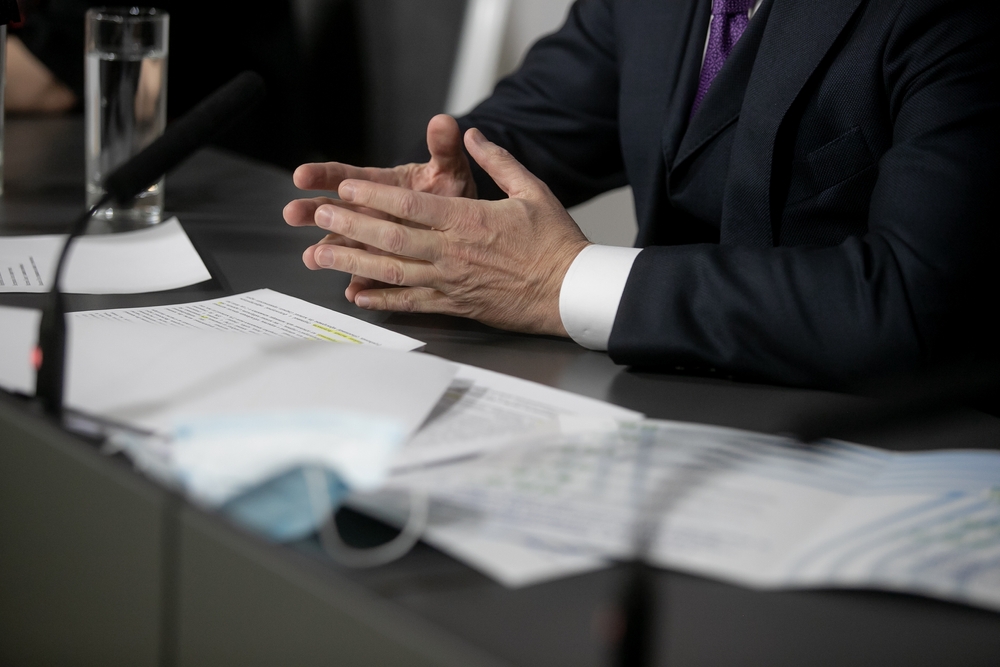 A man sitting at a table during a criminal defense consultation.