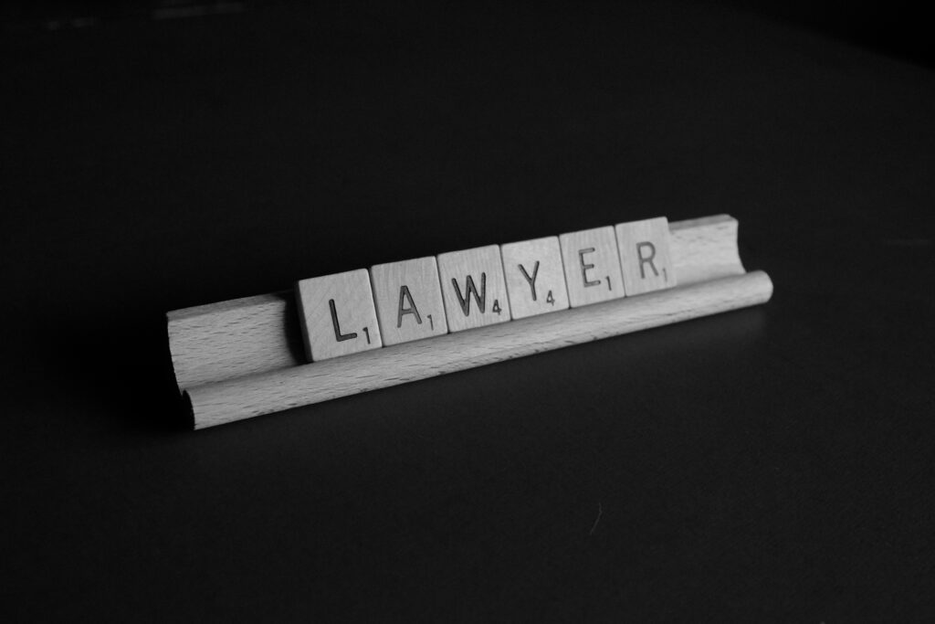 Scrabble tiles spelling 'LAWYER' representing McCray Law Firm